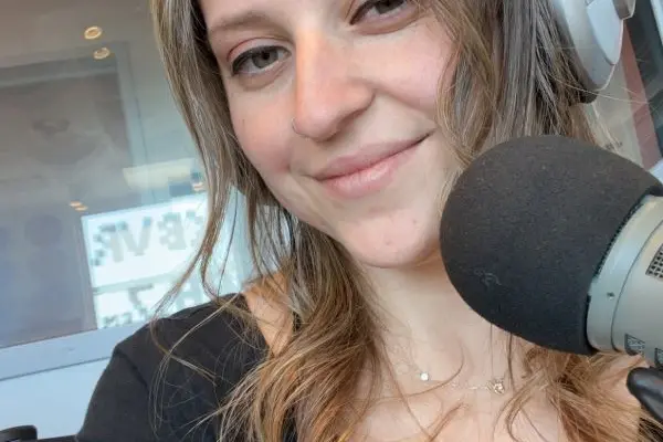 Selfie of Megan Vazquez smiling with headphones on 